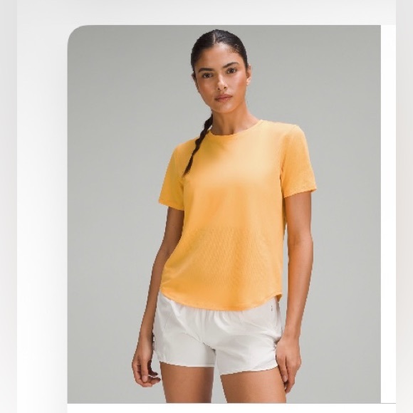 lululemon athletica Tops - lululemon high neck running and training t-shirt, color
Mango dream, size 2.